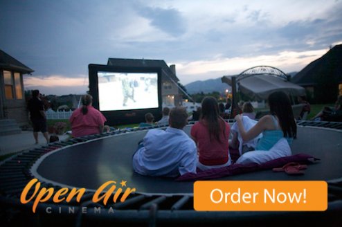 Open Air Cinema 12' Home outdoor theater system in a backyard